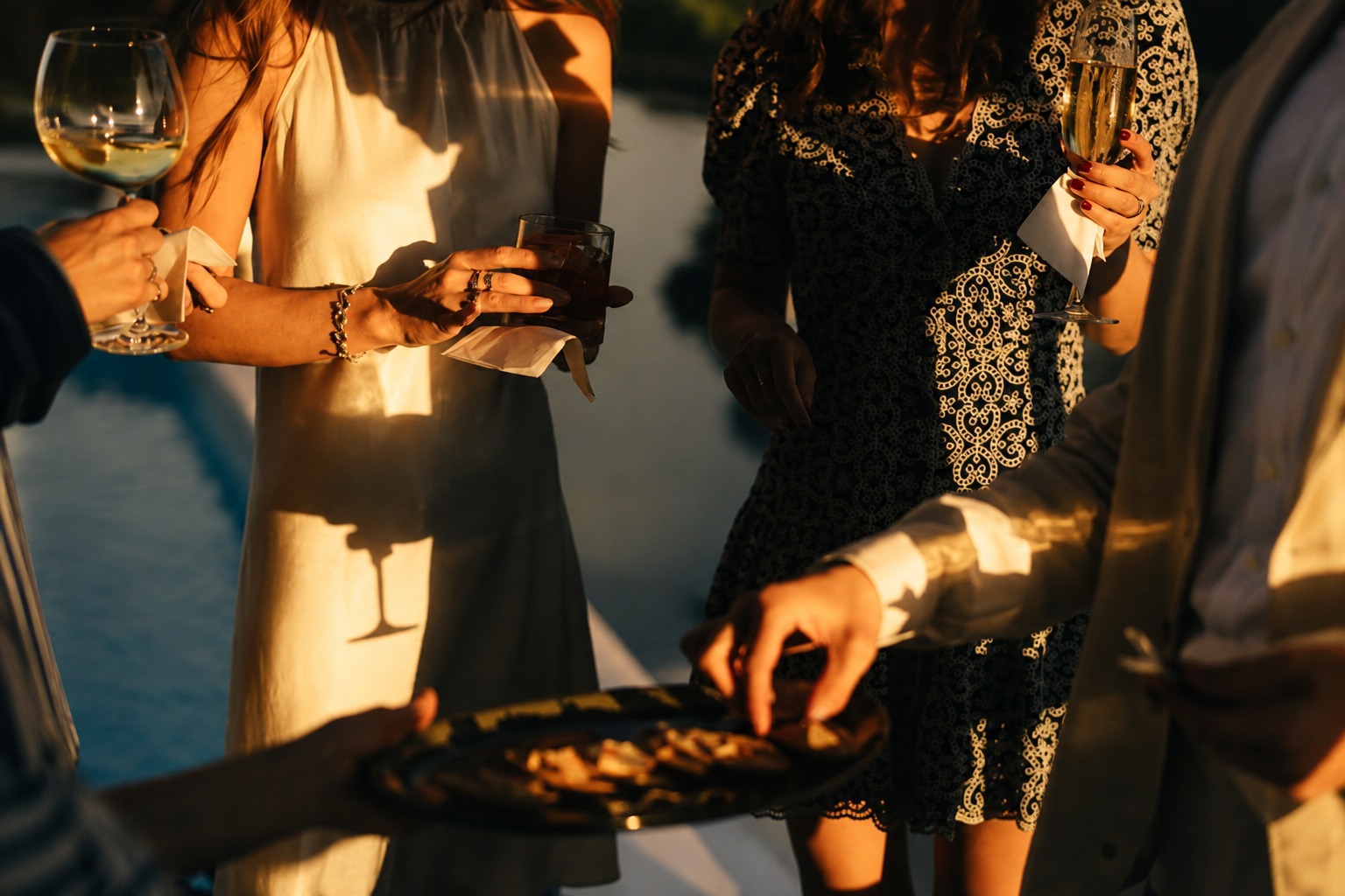 Guests toasting cocktails at an elevated hour reception