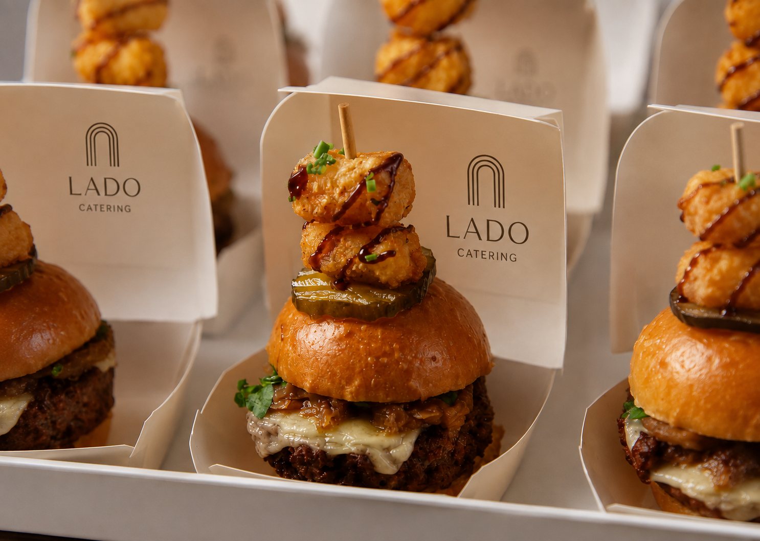 Lado-branded slider skewers plated for a cocktail reception